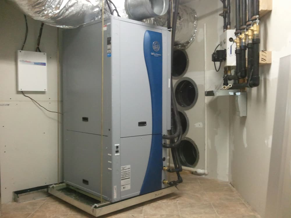 A WaterFurnace geothermal heat pump unit installed in a utility room