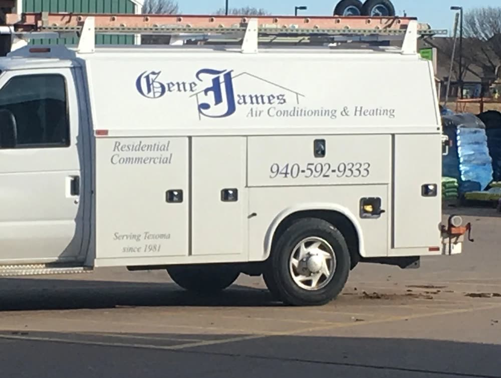 The side of a Gene James service van with the company name, phone number and the words Residential and Commercial